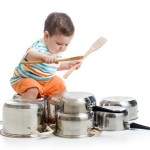 toddler playing with saucepans